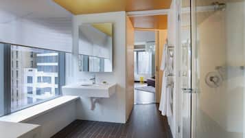 1 King Bed 1-Bedroom Suite Deluxe Room with City View | Bathroom | Shower, rainfall showerhead, designer toiletries, hair dryer