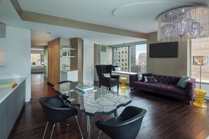 1 King Bed 1-Bedroom Suite Deluxe Room with City View | Living area | 49-inch flat-screen TV with cable channels, TV, first-run films - The Washington (New York)