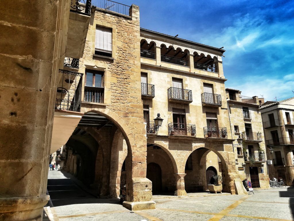 A historic building with multiple balconies and arches.