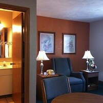 Desk, blackout drapes, iron/ironing board, free rollaway beds