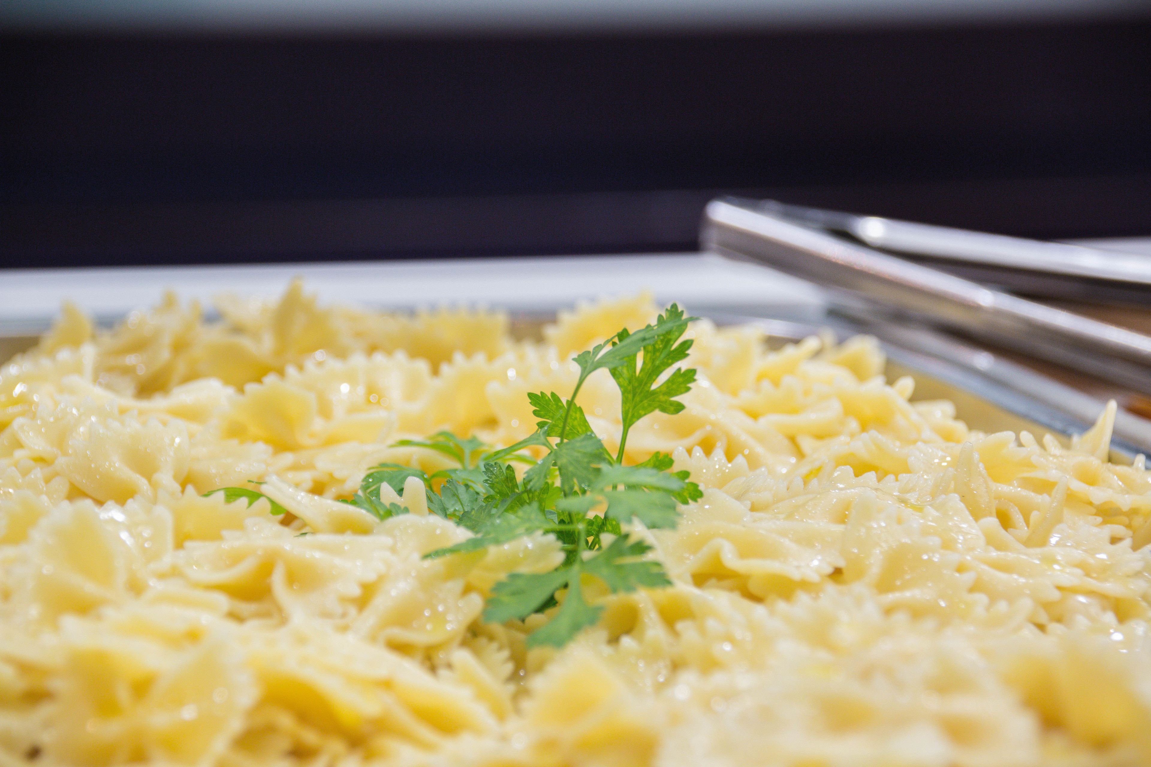 A close-up of a pasta dish garnished with parsley.