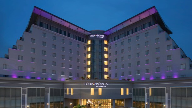A hotel with a symmetrical facade, multiple floors, and a central entrance. - Four Points by Sheraton Lagos (Lagos)