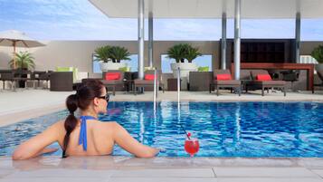 Outdoor pool, open 7:00 AM to 7:00 PM, pool umbrellas, sun loungers