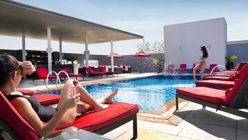 Outdoor pool, open 7:00 AM to 9:00 PM, pool umbrellas, pool loungers