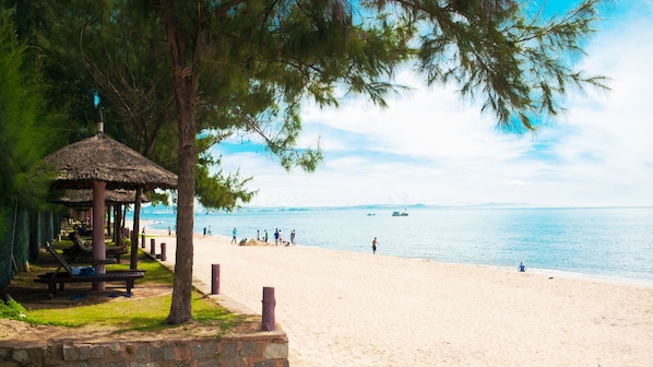 Private beach, white sand, sun loungers, beach umbrellas