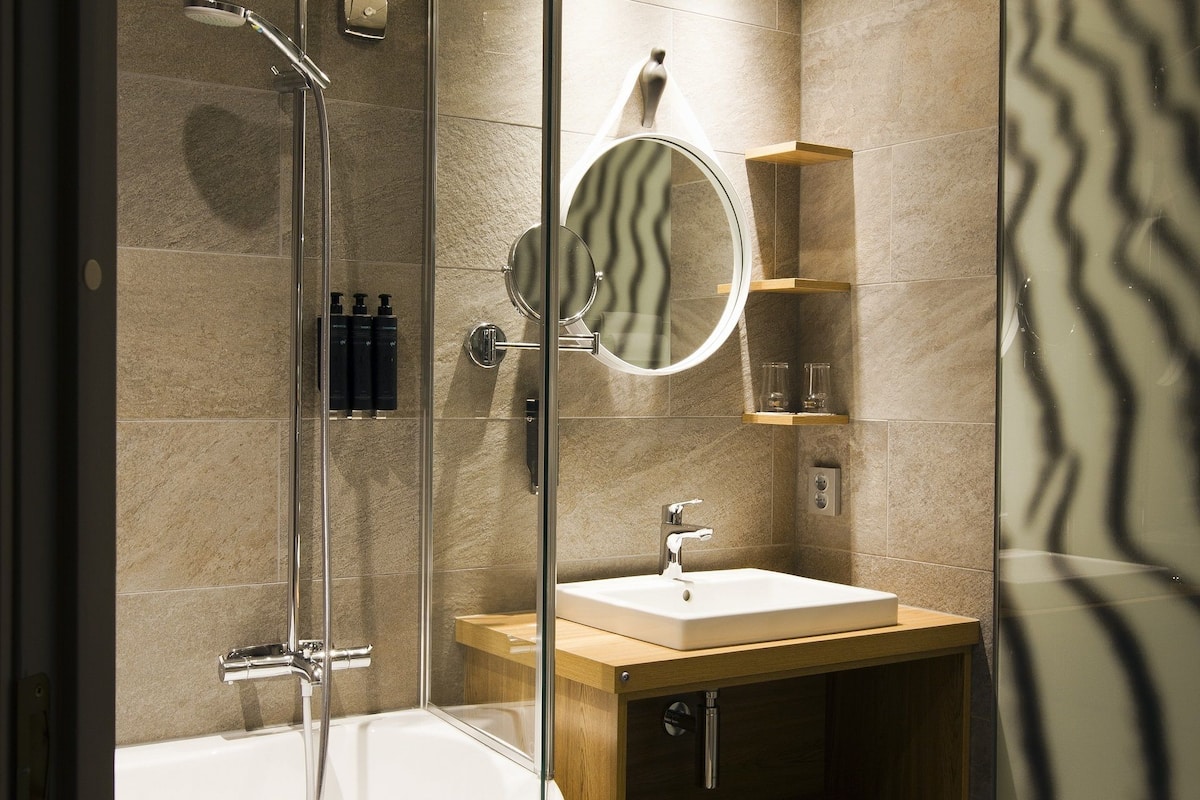 superior suite | bathroom | hair dryer, bathrobes, towels