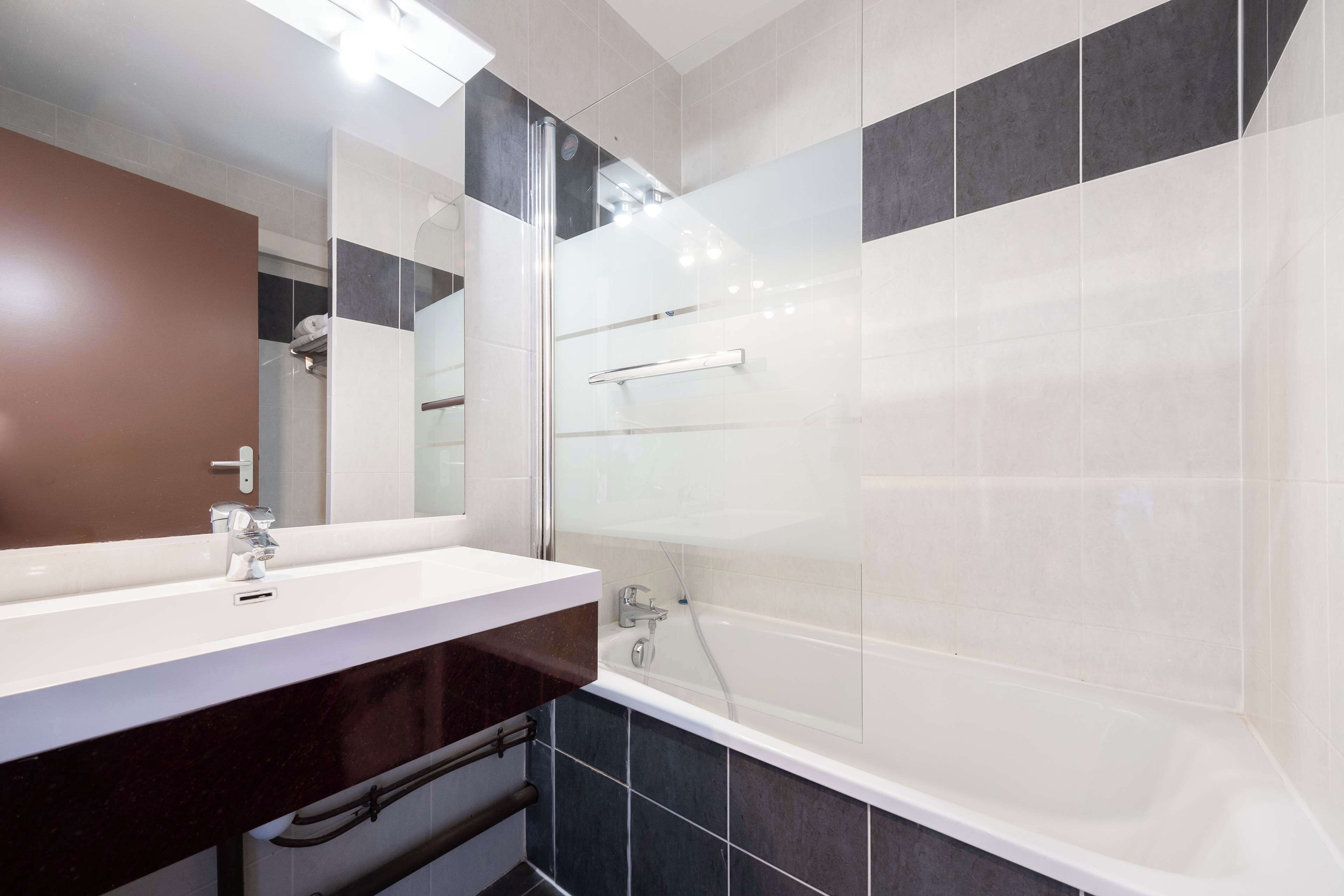 standard room - 1 double bed 3 single beds | bathroom | free toiletries, hair dryer, towels