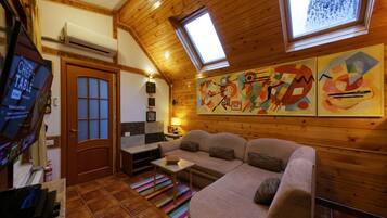 Villa Bruno | Living room | 132-cm LED TV with satellite channels, TV, Netflix