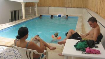 Seasonal outdoor pool, pool umbrellas, pool loungers