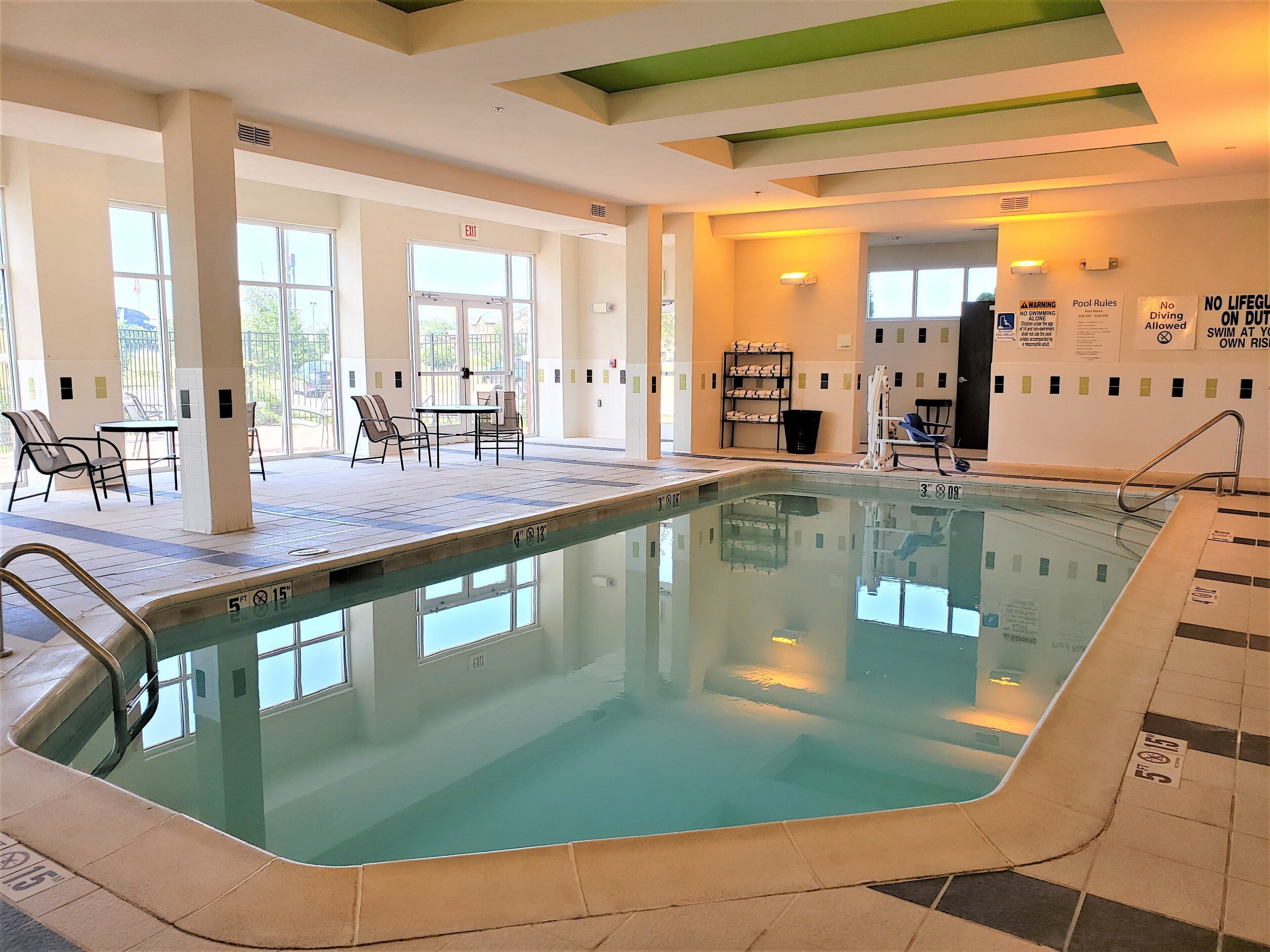 Indoor pool, open 8:00 AM to 10:00 PM, pool loungers