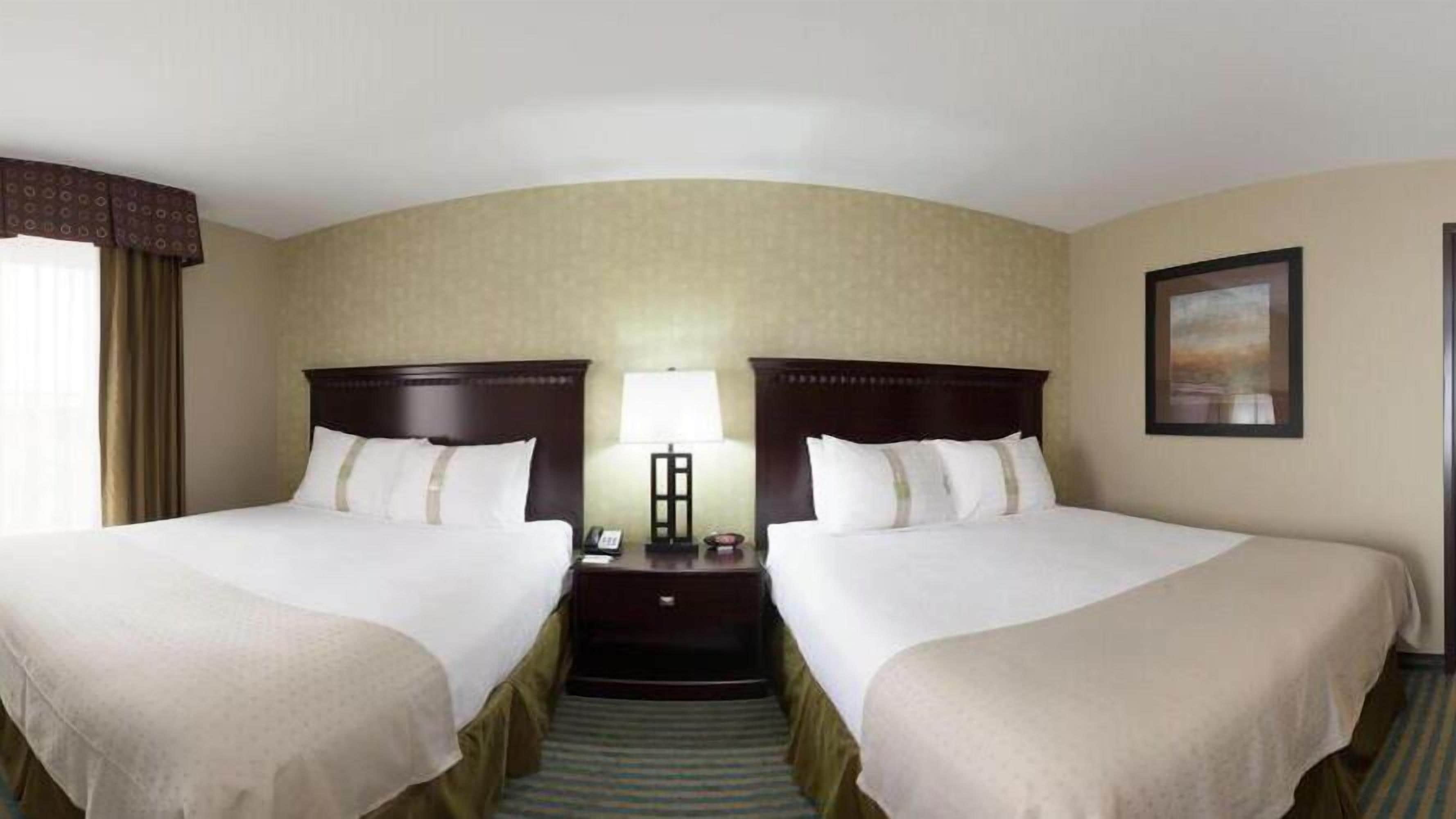 premium bedding, pillow-top beds, desk, blackout curtains