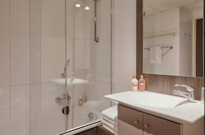 Bathtub, eco-friendly toiletries, hair dryer, towels