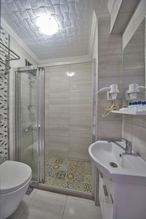 Shower, free toiletries, hair dryer, slippers