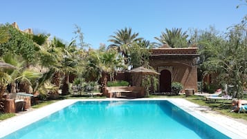 Outdoor pool, open 9:00 AM to 9:00 PM, free cabanas, pool umbrellas