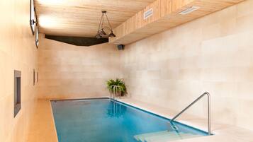 Indoor pool, pool umbrellas, sun loungers