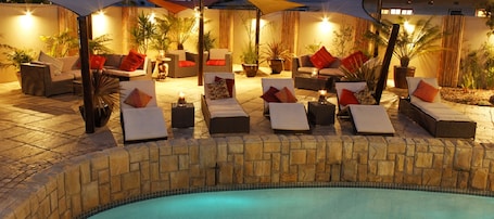 Outdoor pool, pool loungers. African Breeze Guest House