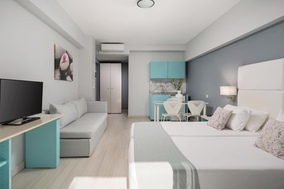Superior Studio, Pool View | In-room safe, individually decorated, desk, soundproofing