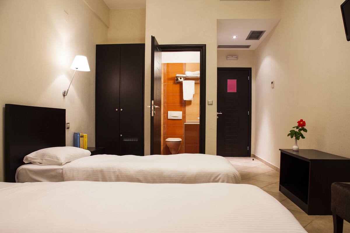 deluxe twin room, balcony | pillow-top beds, in-room safe, individually furnished, blackout curtains