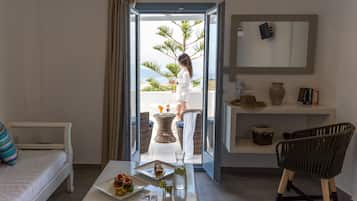 Junior Suite, Sea View | Living area | TV