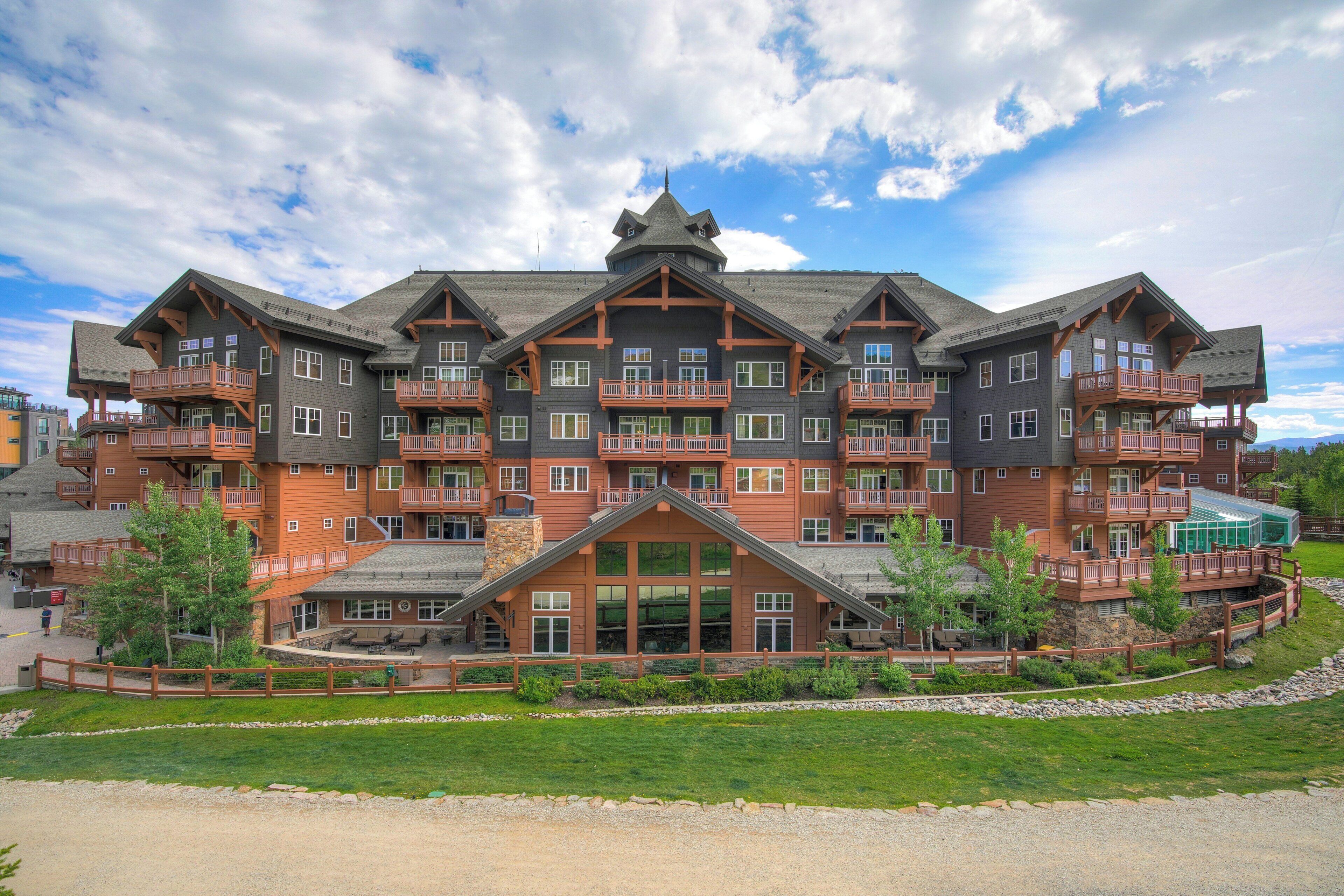 A large, multi-story hotel with balconies and a central entrance.