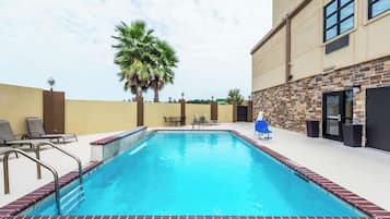 Outdoor pool, open 9 AM to 10 PM, pool umbrellas, pool loungers