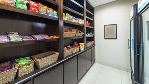 A snack display with various chips and snacks. - Wingate by Wyndham Lake Charles Casino Area (Lake Charles)