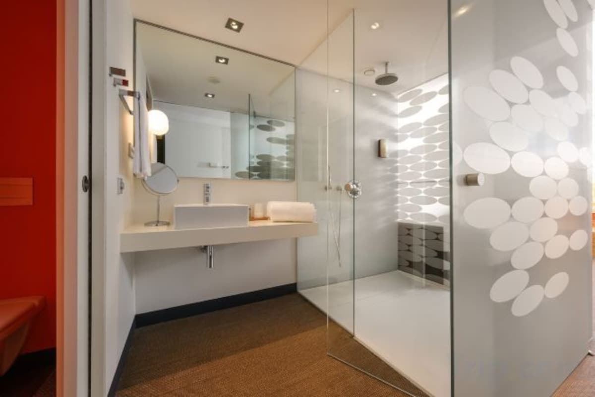Bathroom | Rainfall showerhead, designer toiletries, hair dryer, bathrobes