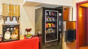 A vending machine with snacks and a milk dispenser. - Econo Lodge Edson - 2nd Ave (Edson)