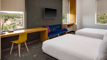 Hypo-allergenic bedding, down duvets, pillow-top beds, in-room safe