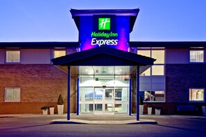 A Holiday Inn Express hotel with a glass facade and a blue awning. - Holiday Inn Express Shrewsbury by IHG (Shrewsbury)