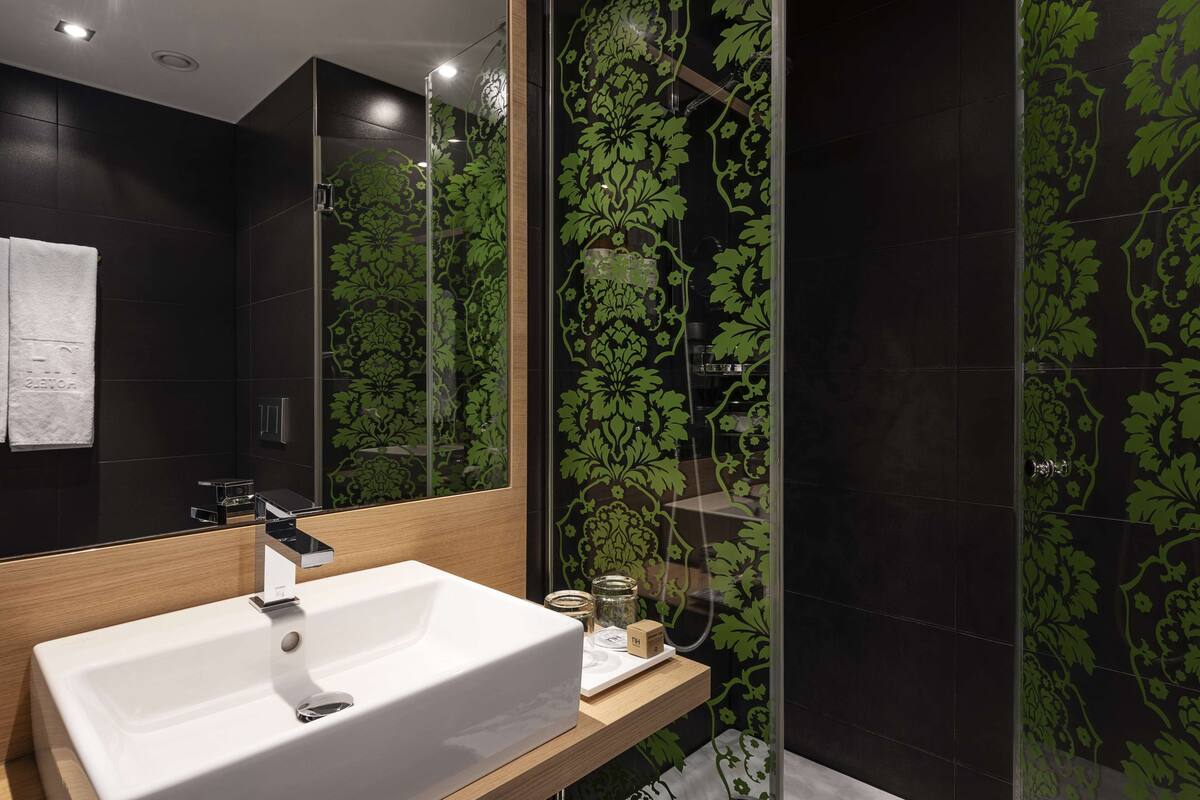 shower, eco-friendly toiletries, hair dryer, towels