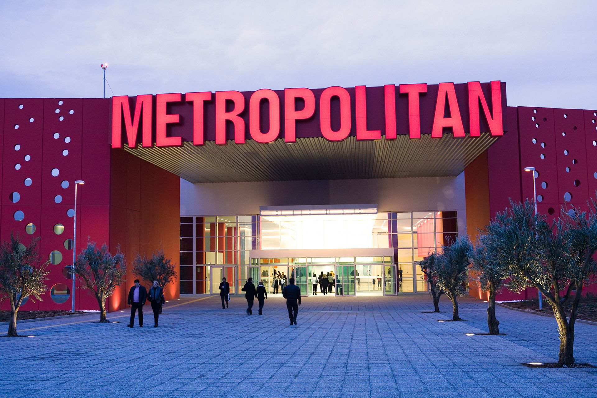 A modern building with the word "METROPOLITAN" prominently displayed above the entrance.