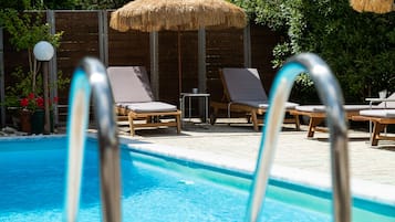 Outdoor pool, open 11:00 AM to 7:00 PM, pool umbrellas, sun loungers