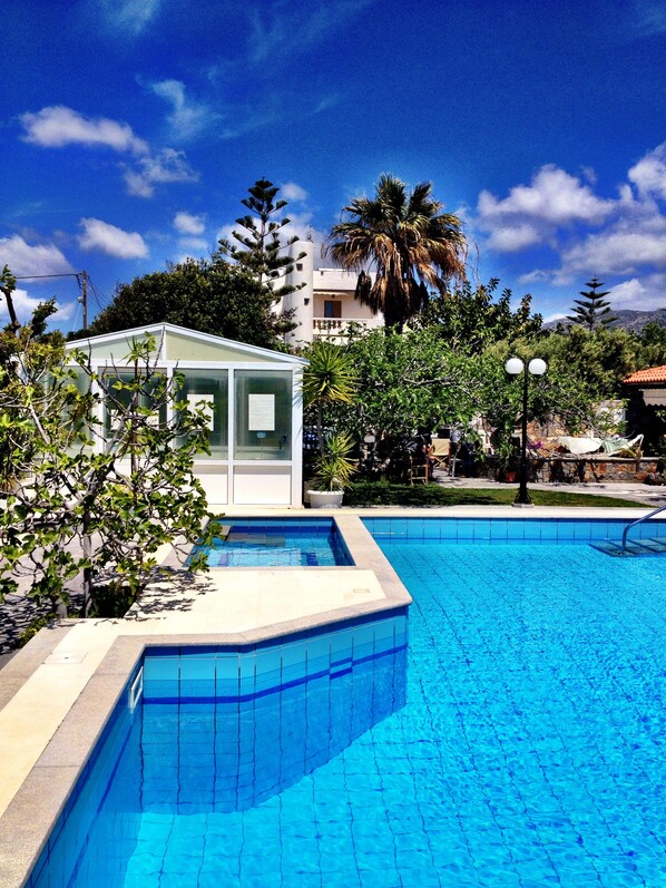 Indoor pool, outdoor pool, pool umbrellas