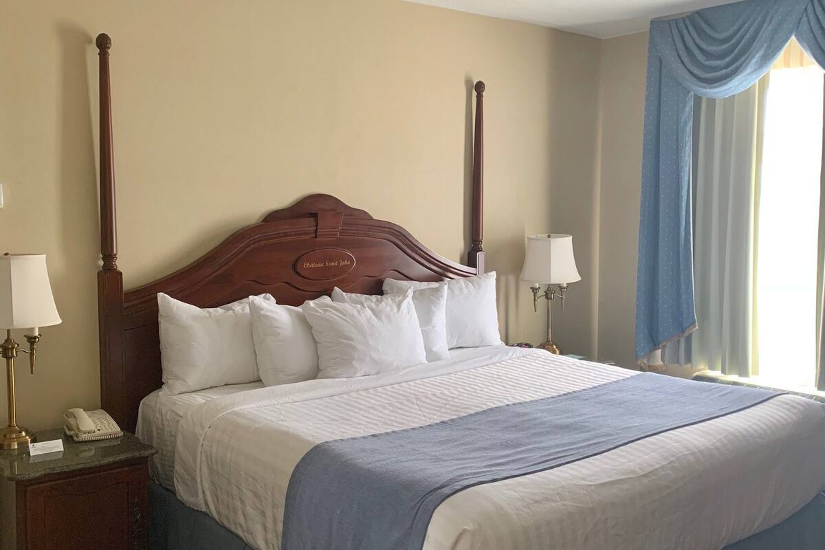 suite, 1 king bed, non smoking | in-room safe, desk, iron/ironing board, free cots/infant beds
