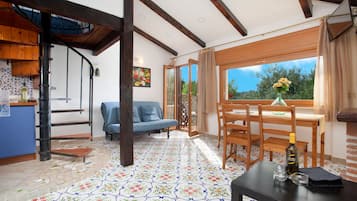 Exclusive Apartment, 1 Bedroom | Living area | 25-inch LED TV with satellite channels, TV