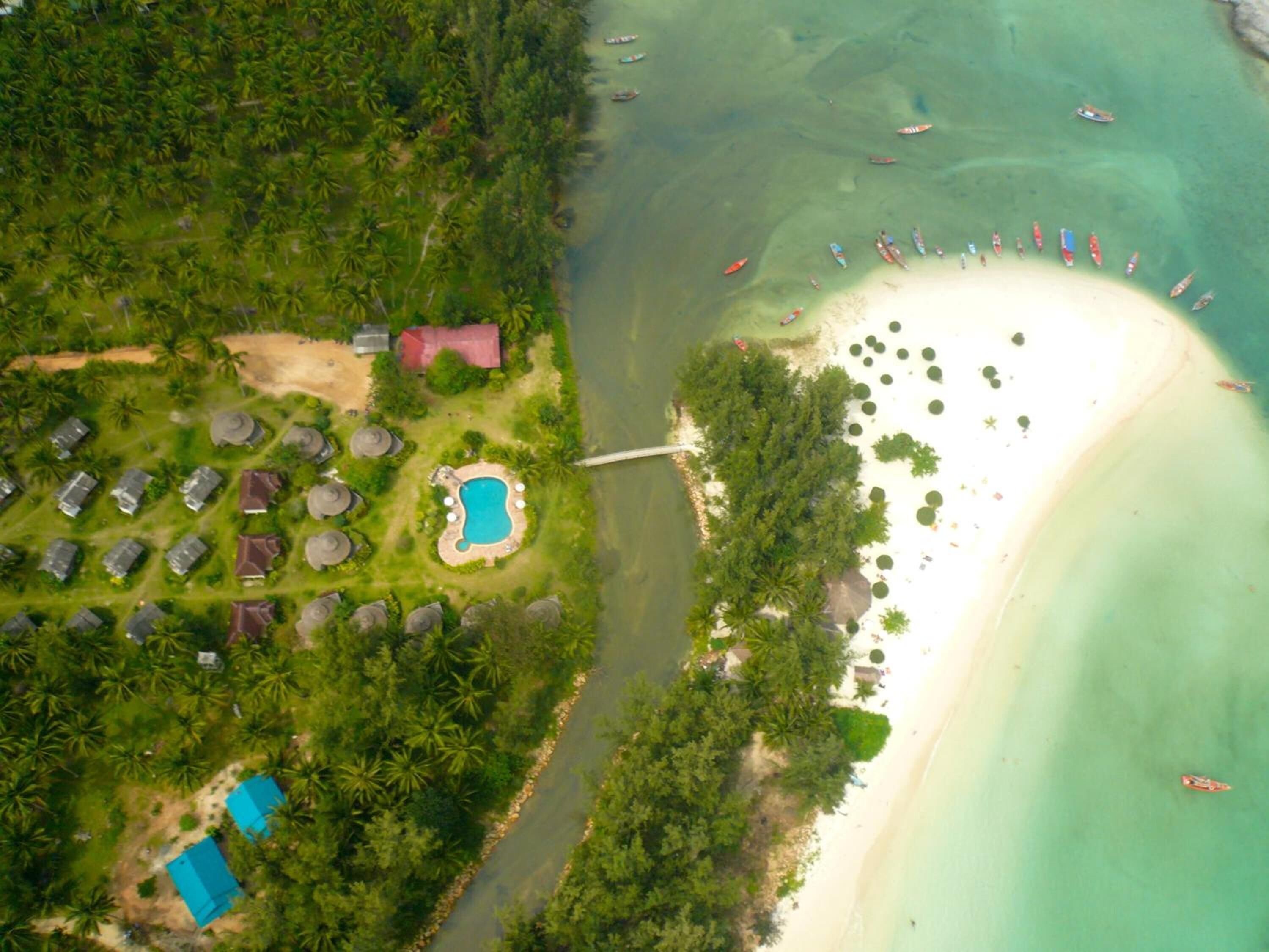Beach nearby, white sand, beach umbrellas, beach towels