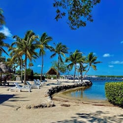 Private beach, white sand, sun loungers, beach umbrellas