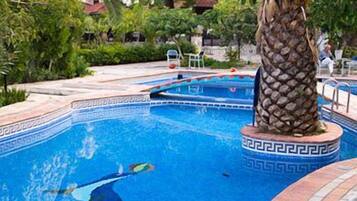 Seasonal outdoor pool, pool umbrellas, pool loungers