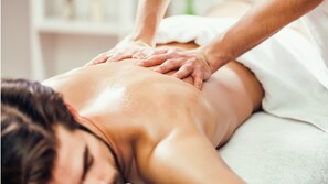 A person receiving a back massage.