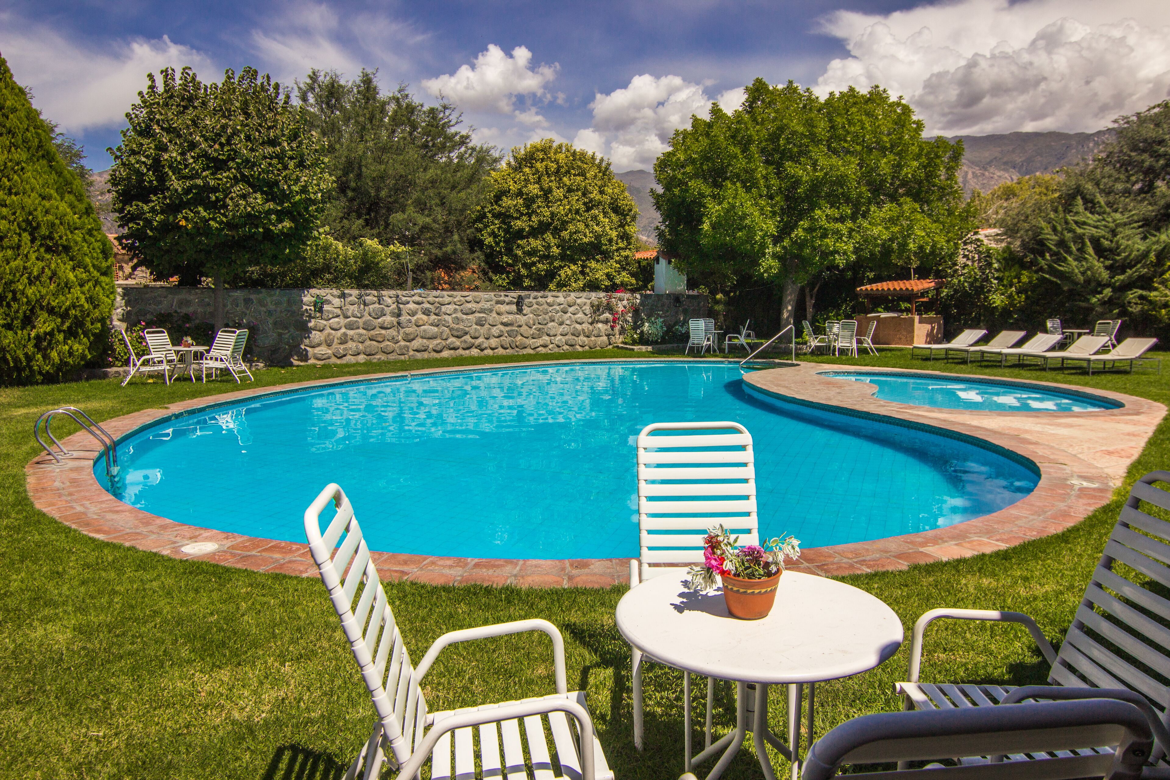 Outdoor pool, open 9 AM to 8 PM, pool umbrellas, pool loungers