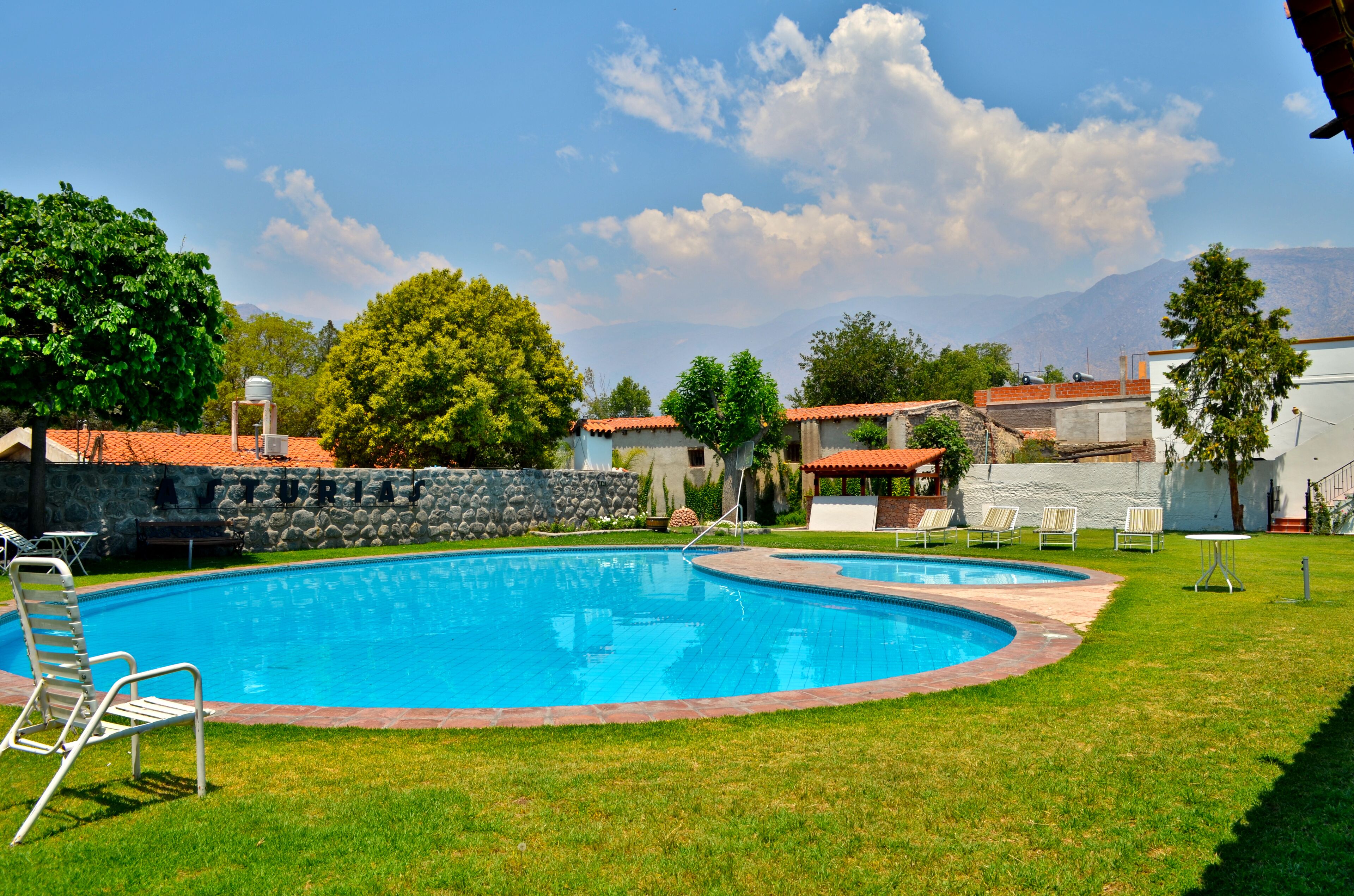 outdoor pool, open 9 am to 8 pm, pool umbrellas, pool loungers