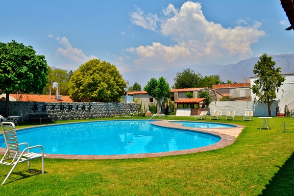 Outdoor pool, open 9 AM to 8 PM, pool umbrellas, pool loungers