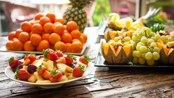 A variety of fruits arranged on a wooden table.
