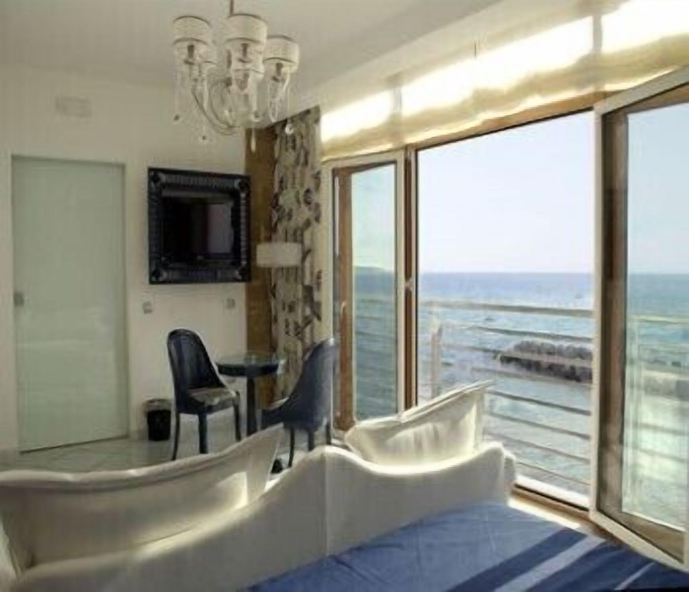 suite, terrace, sea view | living area | 24-inch lcd tv with satellite channels, tv