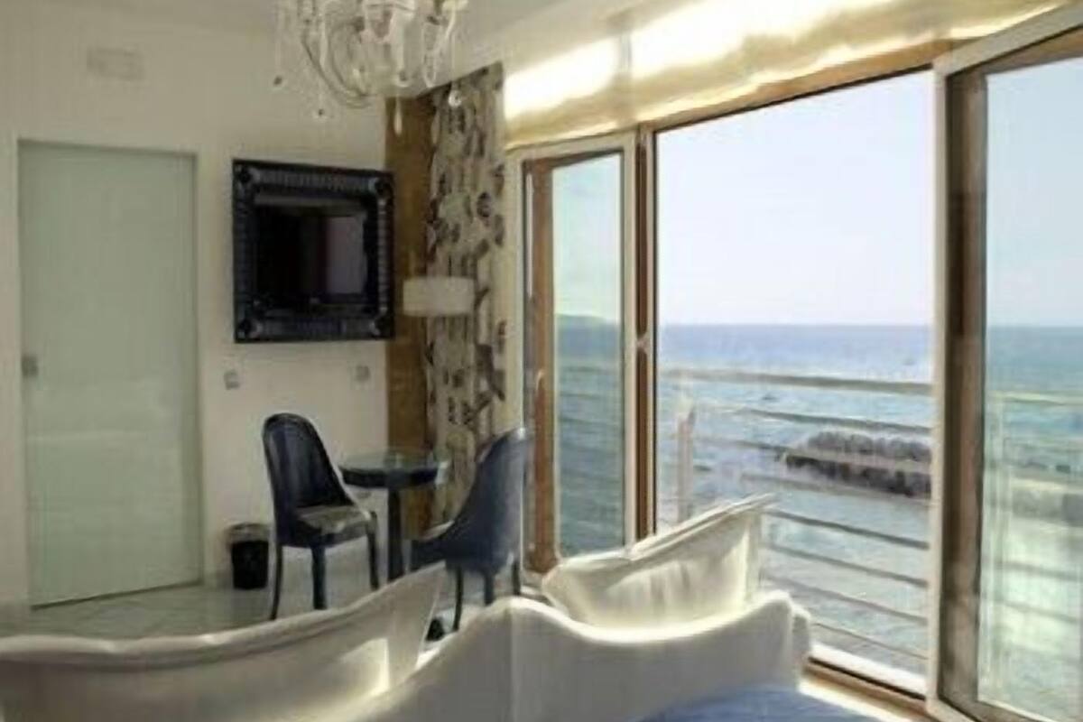 suite, terrace, sea view | living area | 24-inch lcd tv with satellite channels, tv