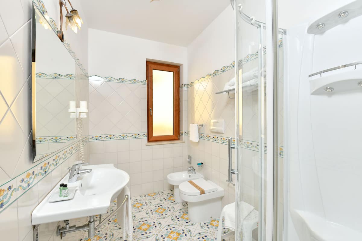 standard triple room, multiple beds, annex building | bathroom | designer toiletries, hair dryer, bathrobes, slippers