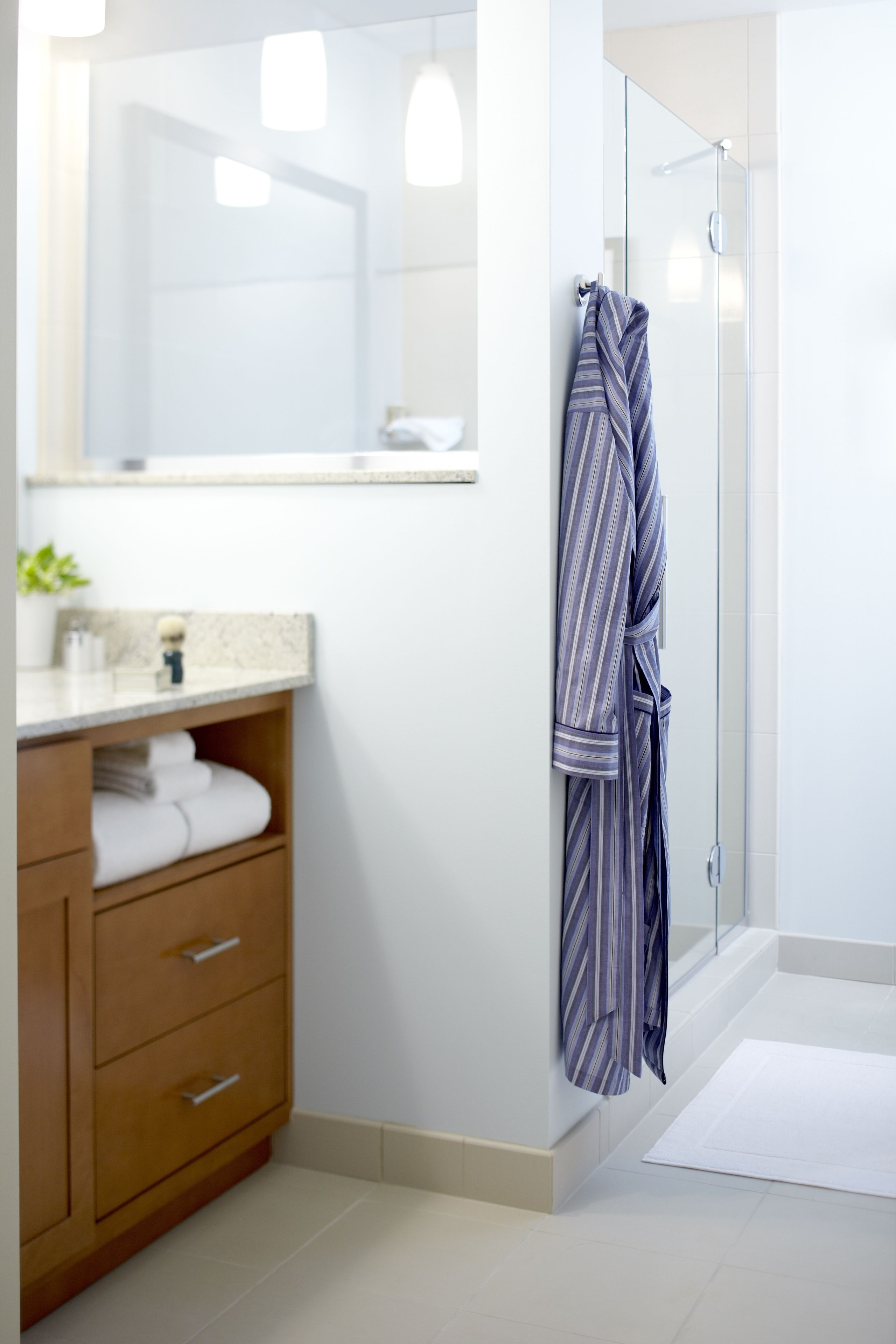 designer toiletries, hair dryer, towels