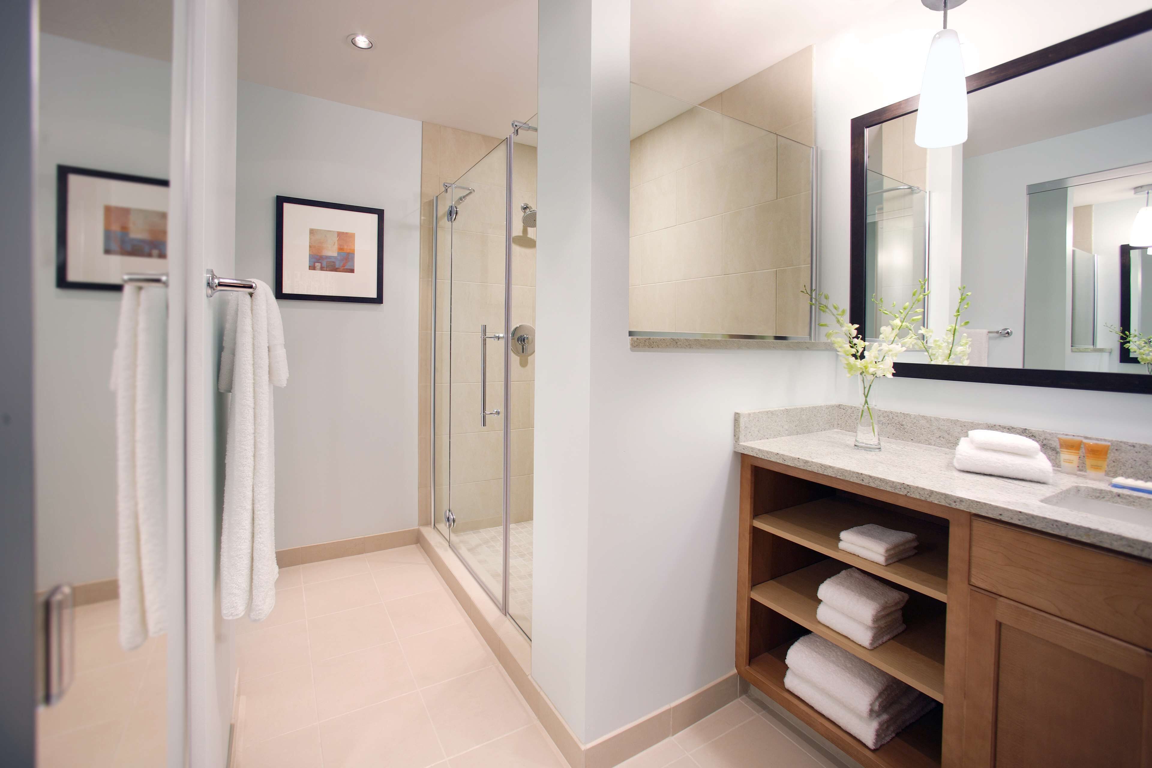 designer toiletries, hair dryer, towels