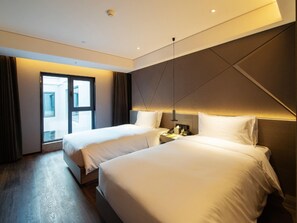 Down comforters, desk, blackout drapes, soundproofing